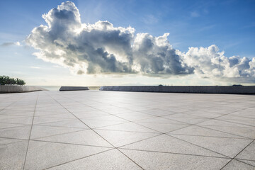 Wall Mural - empty square floor and coastline with sky clouds nature landscape under blue sky. parking lot by the