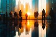 © BerkahStock - Silhouetted people watching sunset over city skyline reflected on floor.