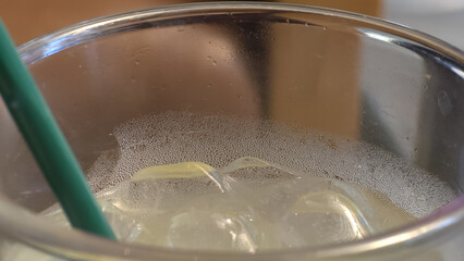 Wall Mural - refreshing drink with ice and condensation in glass