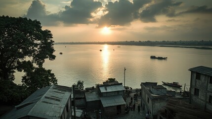 Wall Mural - Scenic riverside view at sunset with boats and buildings along the shore.