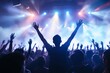 © Pixels Hunter - Crowd enjoying a concert with vibrant stage lights in background.