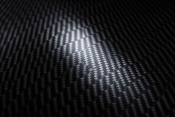Wall Mural - close-up of carbon fiber texture illuminated with light in a creative abstract style.
