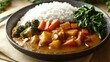 © jaidil - A bowl of curry with rice and greens, showcasing a colorful meal.