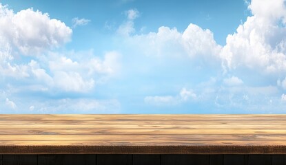 Wall Mural - wooden table against a bright blue sky with fluffy clouds. (2)