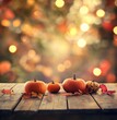 © Nafeesa - Vibrant orange pumpkins surrounded by colorful autumn leaves on a rustic wooden surface. Perfect for seasonal, autumn, and Thanksgiving themes.