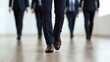© FarhaStock - Businessmen Walking in a Modern Office Setting with Focus on Formal Attire and Footsteps