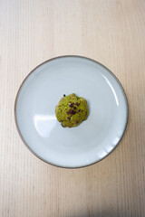 One green tea matcha cookie on the plate.