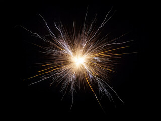 Poster - A radiant burst of light and energy explodes against a stark black background, creating a mesmerizing display of sparking lines and glowing embers.  The image evokes feelings of power and intensity.