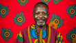 © Lauren - Confident middle aged Kenyan man in vibrant kente cloth outfit on crimson background, culture, confident