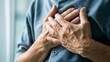 © SIYI - Person clutching chest in pain, a poignant moment of vulnerability and struggle, capturing the universal human experience of physical and emotional distress.