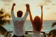 © Papukos - Happy couple raising hands at sunset in convertible car