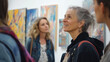 © Nitana Film Media - Mature caucasian woman admiring art in gallery with diverse group of adults, people