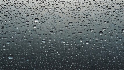 Wall Mural - closeup view capturing the intricate condensation of fog on a window glass surface, showcasing the d