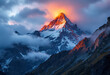 © Valentin - Colorful mountain landscape with great mountain lit by dawn sun among dark clouds. Awesome alpine scenery with high mountain pinnacle at sunset or at sunrise.
