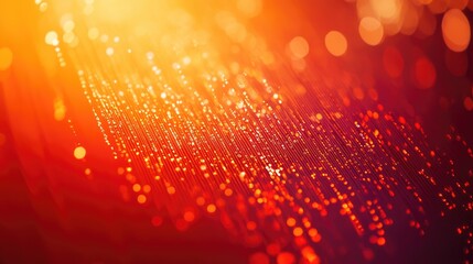 A close-up of computer code in vibrant red and orange, digital data processing on a screen with a blurred bokeh effect in the background.