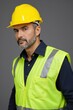 © haiqiang - arafed man in a yellow safety vest and hard hat