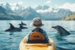 © Sanchai - A serene scene of a kayaker resting in a quiet bay, with a pod of dolphins surfacing nearby