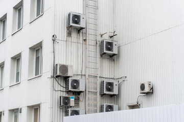 Many air conditioners on a white background of an industrial plant