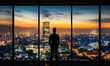 © Vergiliy - City skyline at sunset viewed from high-rise building, silhouette of man in formal attire, vibrant urban landscape, glowing lights, panoramic view