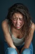 © StockUp - A woman is captured in a moment of intense emotion, expressing deep sorrow and vulnerability.