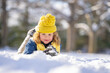© Volodymyr - Child playing with snow, outdoors during snowfall. Winter child, outdoor portrait. Child play in the snow. Child play in snow park. Winter kids face. Happy kid teen boy in snow. Winter kids activity.