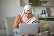 © ThomasLENNE - Muslim mother working at home