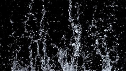 Wall Mural - Slow motion of splashing water on black background , filmed on high speed cinematic camera at 1000 FPS