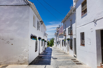 Naklejka na meble Unique white painted village of Mijas (not far from Malaga) - Spanish hill town overlooking the Costa del Sol. Wonderful decoration of the houses in Mijas. Mijas, Andalusia, Spain.