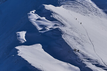 climbing the snowy mountain on sunny weather, expedition concept. best place for relaxation