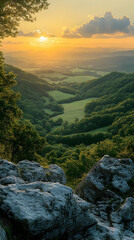 Poster - Scenic sunset view over lush green valley from rocky clifftop.