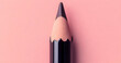 © Emons - Close-up of a sharpened pencil against a pink background, highlighting design and color. Work from home product