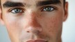 © KHF - Close-up of a handsome young man's face, highlighting a smooth complexion and well-groomed features.