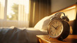 © 沈军 贡 - A vintage alarm clock on the bedside table, with morning sunlight streaming in through an open window