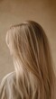 © Galaxyd - Back view of a woman with long blonde hair.