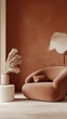 © Galaxyd - Cozy armchair and pampas grass in a vase in an orange living room.