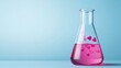 © Boontharika - Pink liquid with heart shapes in a chemistry flask on a blue background.