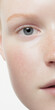 © CQSP - Clear and Spotless Teen Face Close-Up Capturing Natural Beauty, Skin Texture, and Bright Expression with Soft Lighting Amidst Minimalist Background