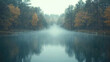 © AbdulHakim - Misty lake with autumn trees reflecting in the calm water.