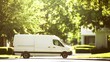 © F - Delivery van driving away on street, symbolizing efficient logistics and timely service in modern transportation and supply chain management