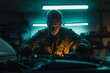 © Максим Фокин - Mechanic focusing on car engine repairs under neon lights.