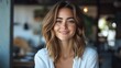 © Ashalina - Close-up portrait of a smiling young woman with shoulder-length brown hair.