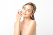 © Shutter B - Happy beautiful young asian woman smile touching her face on white background, clean fresh bare skin concept. Facial treatment, Perfect skin, Natural make up.