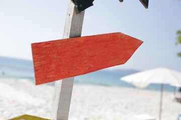 Wall Mural - Wooden sign on the beach