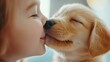 © Gpeg26 - A tender moment between a young girl and a golden retriever puppy as they share a loving nose touch.