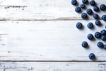 Poster - Fresh wild blueberries are artfully arranged on a clean, distressed white wooden table, creating a delightful composition with generous copy space for text placement