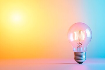 Leinwandbilder - A glowing vintage lightbulb with an elegant filament design shines against a pastel yellow background, adding warmth and inviting charm to any setting