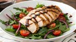 © Larisa - Savory balsamic chicken served on a fresh salad with vibrant cherry tomatoes and crisp greens creating a delightful culinary experience