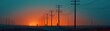 © watcharee - A tranquil landscape featuring silhouetted power poles against a vibrant sunset, casting a warm glow over a serene horizon.
