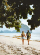 © EVERST - Couple in love walking on Vanilla beach in Palawan, Philippines - travel romantic vacations outdoor lifestyle man and woman together enjoying summer trip honeymoon