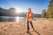 © EdNurg - Female hiker enjoying the sunrise while walking near the Black Lake in Durmitor National Park, Montenegro